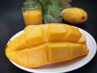 Mango smoothie on black background