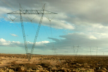 torres de cable de luz en el campo en rutas de la patagonia argentina, escena rural