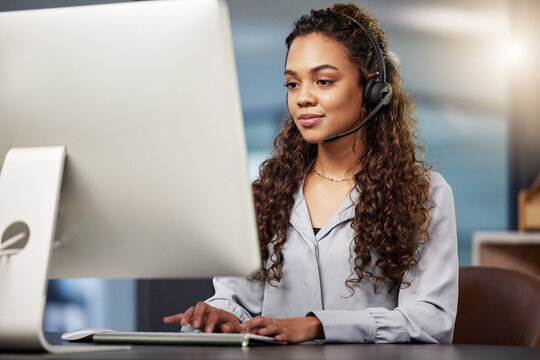 Call center, virtual assistant or woman typing on computer at telecom customer services office job help desk. Microphone, technology or female sales agent consulting or helping in tech support on pc