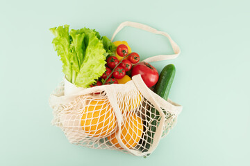 string bag with orange fruits with vegetables and fruits,Responsible consumption with a net bag