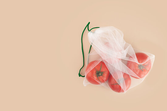 reusable fruit bag with tomatoes on a natural background,responsible shopping