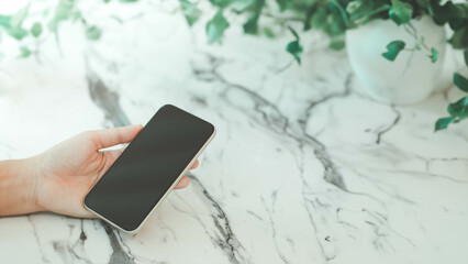 business woman holding smartphone on the male table with green palnt, technology smart robot AI, artificial intelligence, Futuristic technology transformation, Metaverse, big data, Chat bot, GPT
