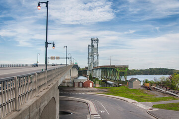 The landmark Sagadahoc and Carlton Bridges over the Kennebec River in Bath Maine on a sunny day.
