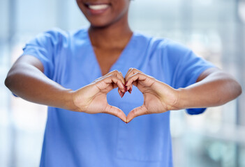 Closeup, black woman and doctor with a heart hands, support and care with happiness, charity and innovation. Female person, medical professional and employee with love symbol, solidarity and feedback