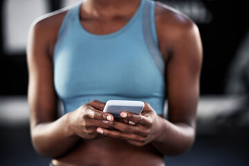 Smartphone, hands or woman in gym on social media to relax on fitness or exercise or workout break. Athlete closeup, texting or girl with mobile app for online digital communication after training