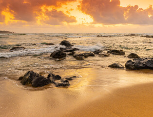 Waves Washing Over Ancient Lava Boulders on Lydgate Beach at Lydgate Beach Park, Lihue, Kauai, Hawaii, USA