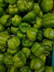 Plakat pile of fresh green peppers sold in supermarkets, shopping for a month's needs for cooking
