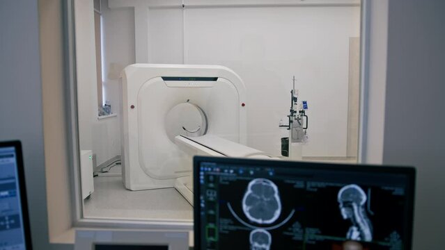 Computer tomography equipment in the clinic a screen with a tomographic image in the medical research room