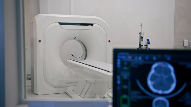 Computer tomography equipment in the clinic a screen with a tomographic image in the medical research room
