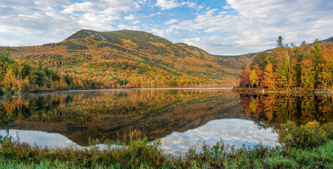 Autumn color reflection at the Basin Brook Reservoir in the White Mountains of New Hampshire 
