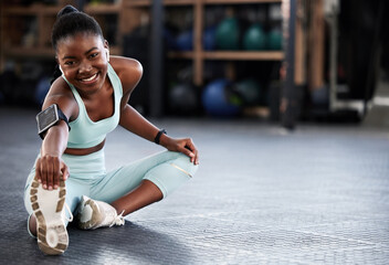 Music, portrait or black woman in gym stretching legs for workout routine or body movement for fitness. Happy, headphones or healthy girl athlete smiling in exercise training warm up for flexibility
