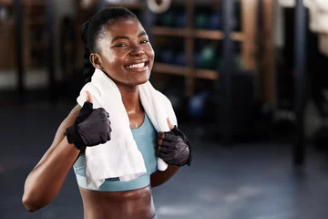 Gordijnen Gym, portrait or happy black woman with thumb up in fitness training with positive mindset or motivation. Encouragement, workout or excited personal trainer with like hand sign, support or thumbs up © Michael Cunningham/peopleimages.com