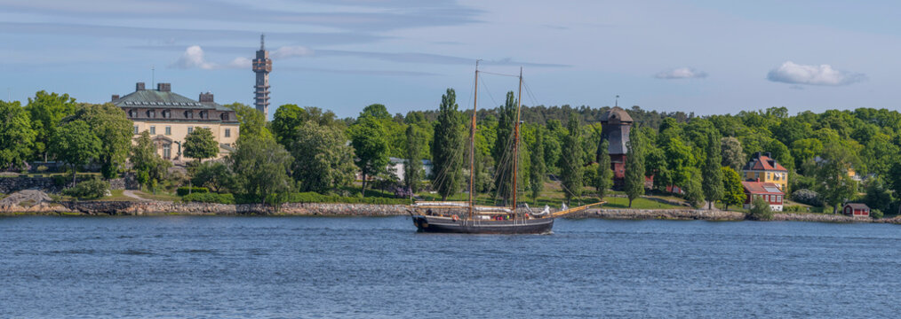 Old two mast sailing boat passing the ness Waldemars udde at the bay Str&ouml;mmen, a sunny summer day in Stockholm