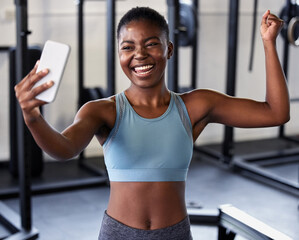 Fototapeta Gym, flexing or happy girl taking selfie on workout, exercise or training break on social media for results. Proud influencer, strong or black woman smiling for pictures or online fitness content obraz
