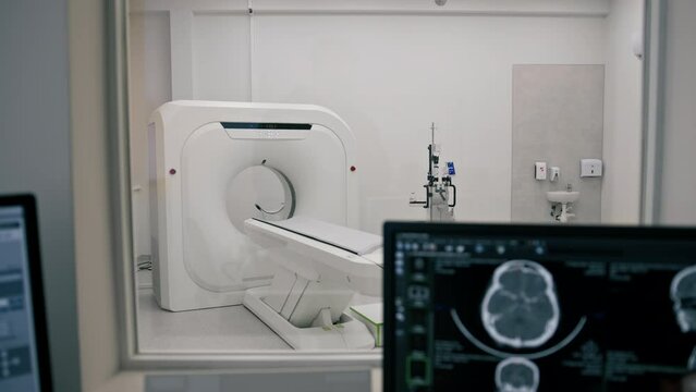Computer tomography equipment in the clinic a screen with a tomographic image in the medical research room
