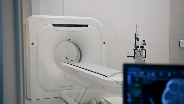 Computer tomography equipment in the clinic a screen with a tomographic image in the medical research room