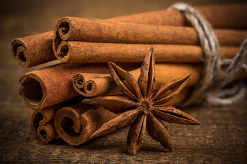 Close up of cinnamon sticks and star anise on wood