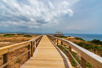 Fototapeta na wymiar Walkways and viewpoint of Praia do Camilo, on the cliffs of Lagos, Algarve, Portugal.