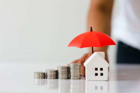 Protection, Pile Of Coins And Mockup House With Umbrella Hand Holding On White Background, Financial Insurance And Safe Investment Concept