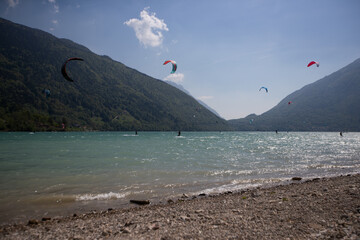 Kite surfing on mountains lake