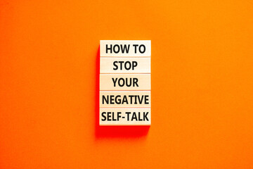 Stop negative self-talk symbol. Concept words How to stop your negative self-talk on wooden block....