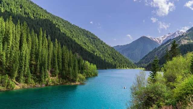 Kolsai Lake, Kazakhstan. Deep mountain lake Lake Kaindy sunken forest landmark in asia. Beautiful mountain nature landscape. Blue lake Kolsai top view. Panoramic view of the nature reserve.