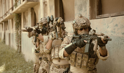 Professional marine soldiers training with weapon on a military range. © Wosunan