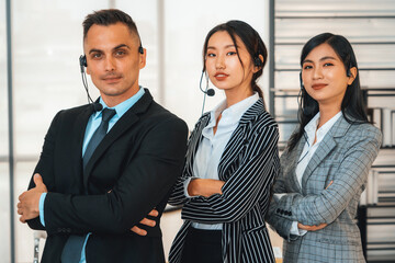 Business people wearing headset working in office to support remote customer or colleague. Call...