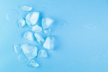 blocks crushed of ice on water drops background