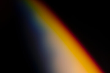 analogic light leak produced with glass crystal and led lights, background is pure black. Perfect for overlays.