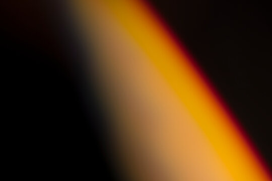 analogic light leak produced with glass crystal and led lights, background is pure black. Perfect for overlays.