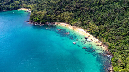 aerial view of paradisiacal brazilian beach with crystalline waters with vegetation and rocks