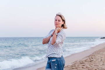 Portrait of a girl walking along the beach of the sea coast