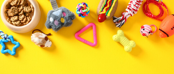 Pet shop banner design. Flat lay cat and dog toys and accessories on color background.