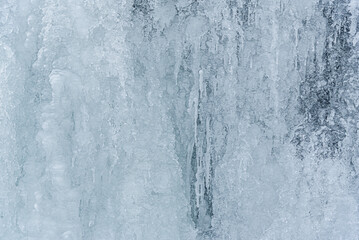 Fototapeta na wymiar Ice. Frozen river. Water frozen in ice in a pond.
