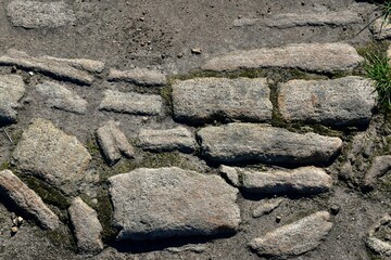Closeup of a fragment of an old stone paved road, England, UK