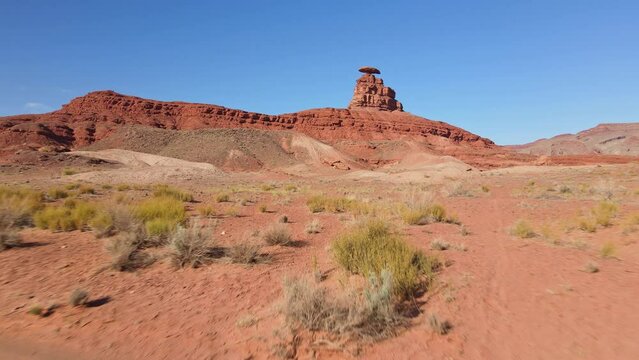 Explore the unique charm of Mexican Hat, Utah, as our drone soars over the picturesque San Juan River.