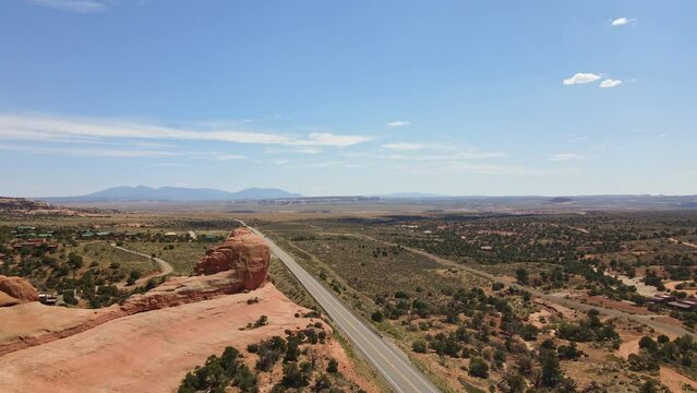 Soaring above Utah's scenic highways, witness the breathtaking beauty of the road unfolding beneath