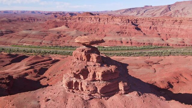 Aerial view of Mexican Hat's stunning rock formation and desert landscape