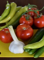 fresh ripe raw vegetables, tomatoes, cucumbers, garlic, peppers 