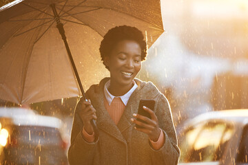 Smile, umbrella and black woman with a smartphone, typing and connection for social media, network...