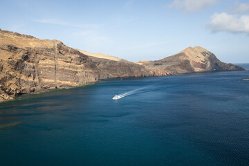 Powerboat off the Rugged Coast of the Island of Madeira