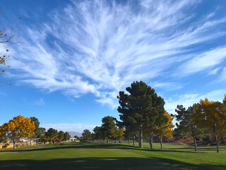 Golf fairway with clouds and sky