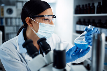 Woman, scientist and analysis of chemical liquid, glass beaker and science chemistry experiment in...