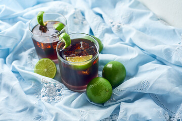 Cuba Libre with brown rum, cola and lime. Cuba Libre or long island cocktail. Focus Selective