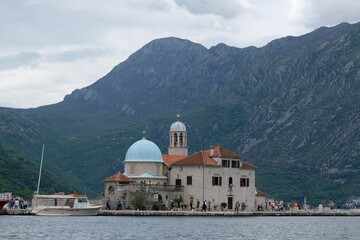 Fototapeta na wymiar Island of Our Lady of Rock (Gospa od Škrpjela) - an artificial island with ancient church in the Adriatic Sea near town of Perast, Montenegro.