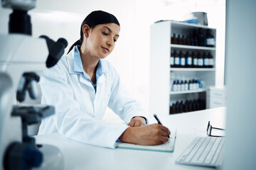 Woman, scientist and writing notes in science research for discovery, breakthrough or information...