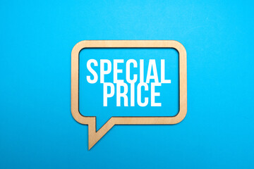 Sale symbol. Concept words Special price in wooden speech bubbles on blue paper background. Big sale concept. Copy space.