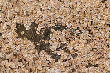 a bunch of fresh dry oatmeal flakes for making porridge