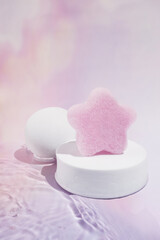 Pink Sponge with White Props and Pastel Cloud Background